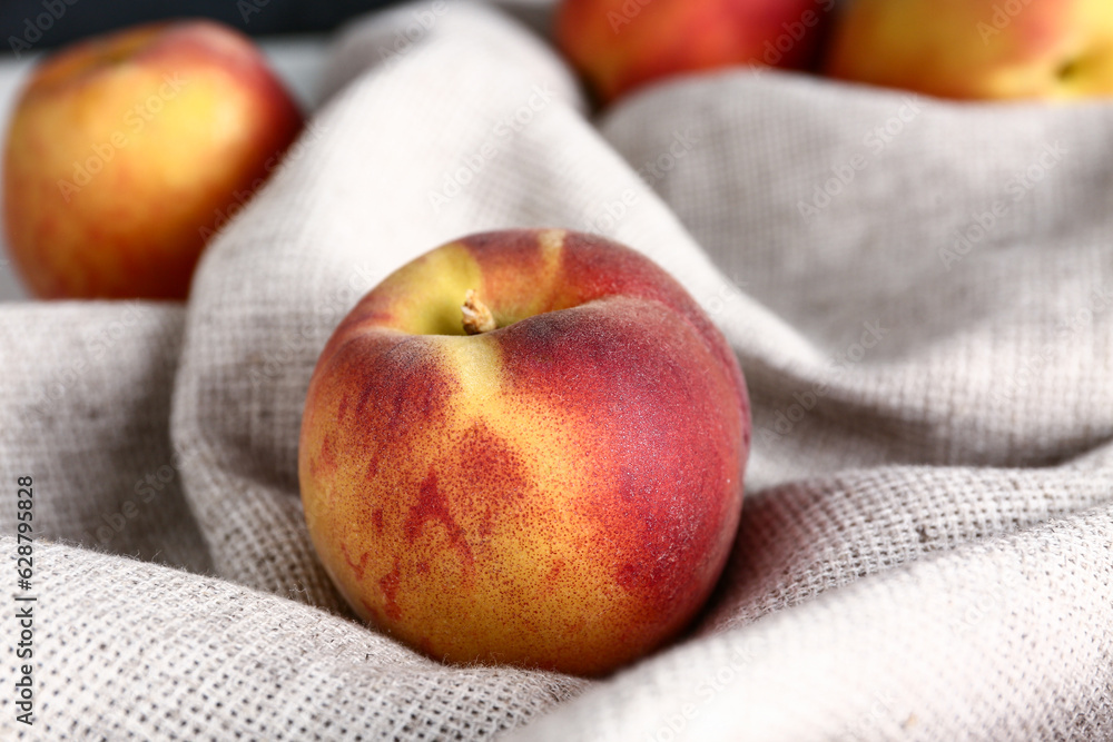 Sweet peaches on napkin, closeup