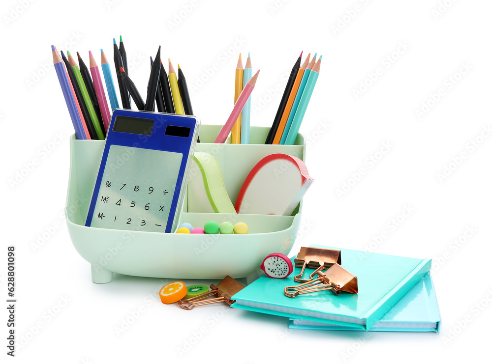 Notebooks and holder with school stationery on white background