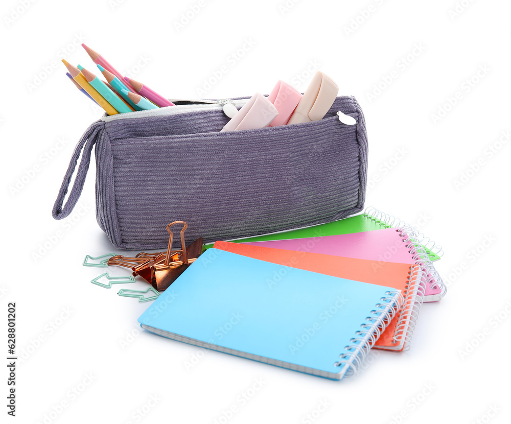 Notebooks and school stationery on white background