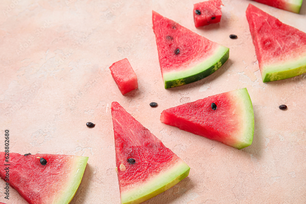 Composition with pieces of ripe watermelon on beige background, closeup