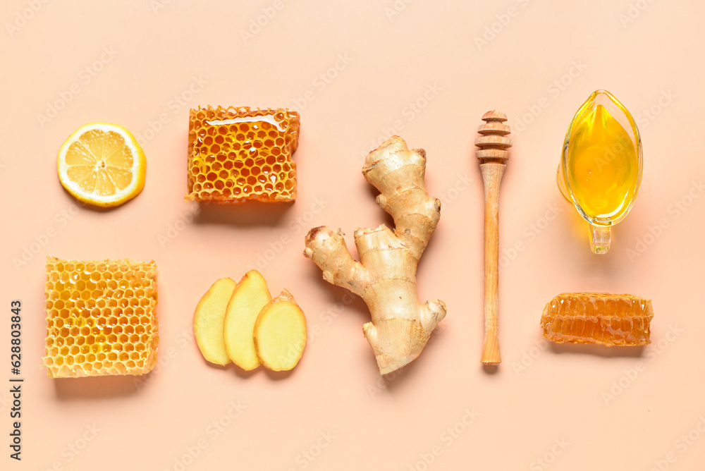 Gravy boat with sweet honey, combs  and ginger on pink background