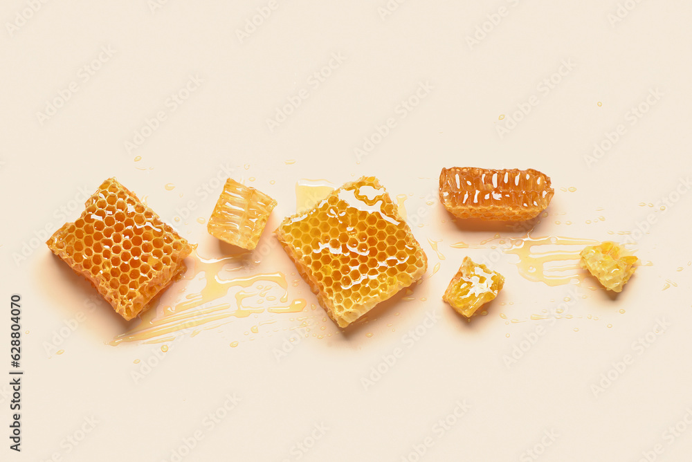 Sweet honeycombs on yellow background