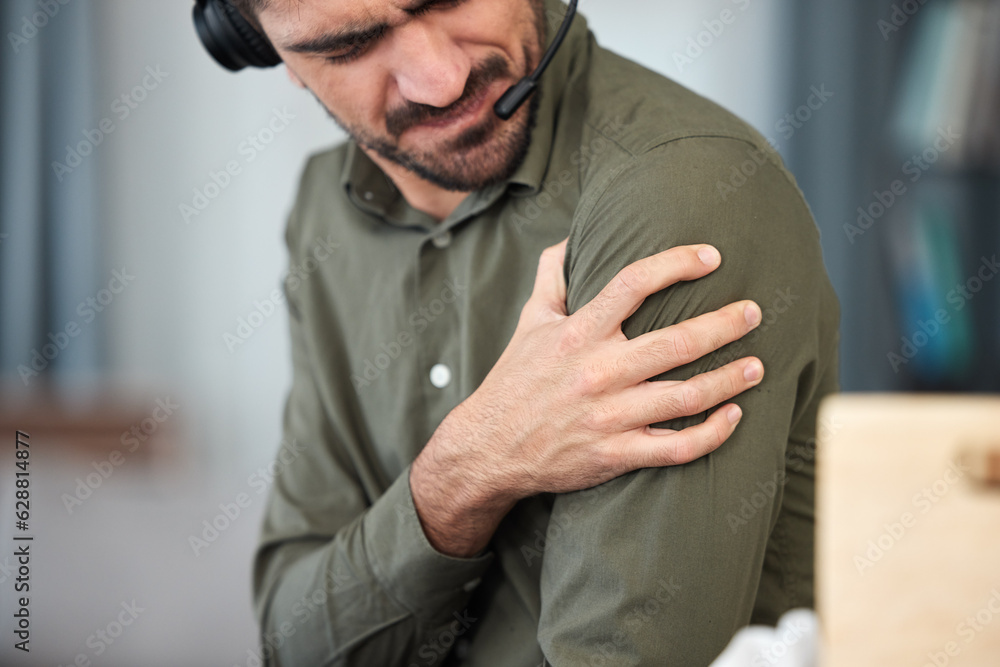 Call center man, shoulder pain and muscle in office, communication expert or consultant with burnout