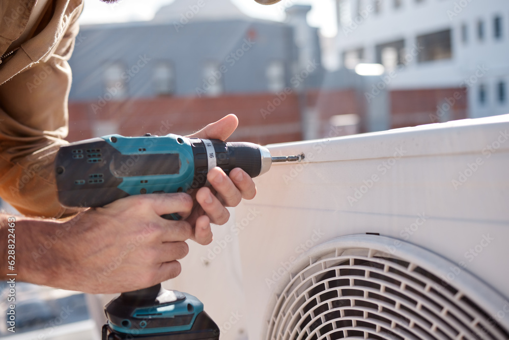 Hands, drill and outdoor with man for air conditioner maintenance, roof and building in cbd for cons