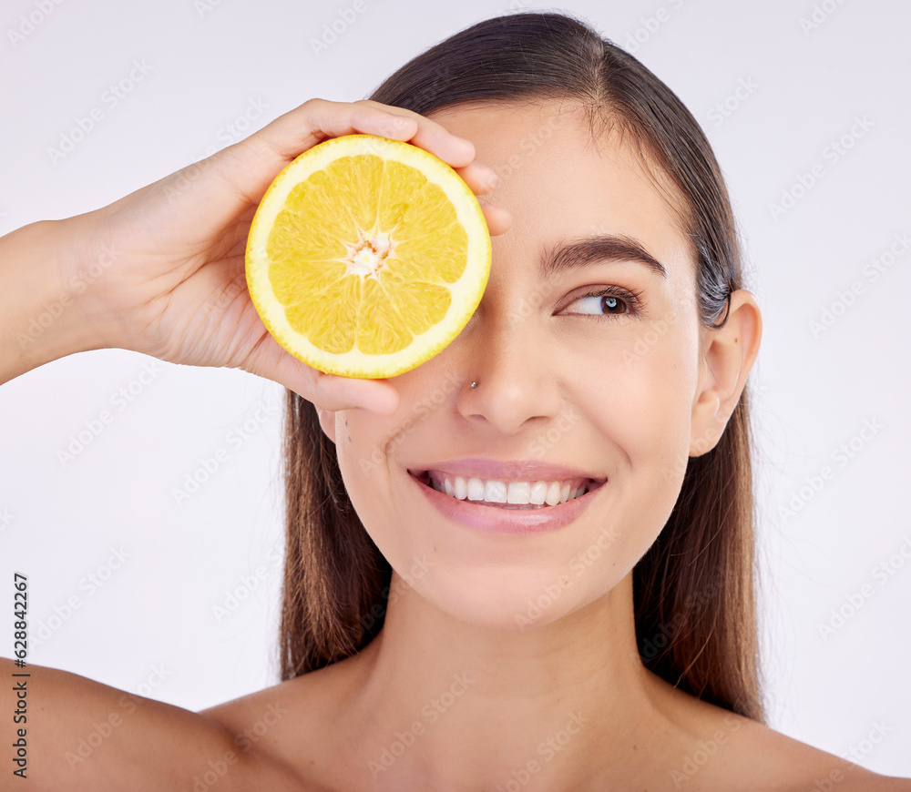 Beauty, studio face and happy woman with lemon for skincare glow, vitamin c detox and natural facial