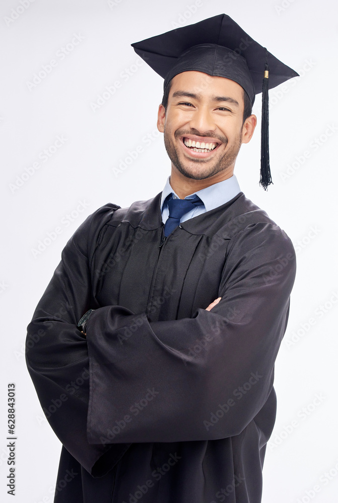 Student man, arms crossed and graduation in studio portrait, smile and success by white background. 