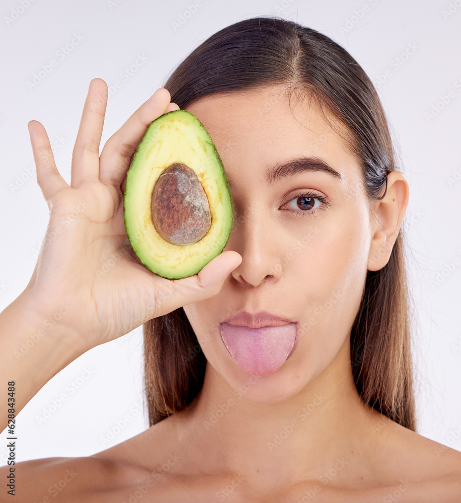 Face, skincare and woman with avocado, tongue out and isolated on a white background in studio. Port