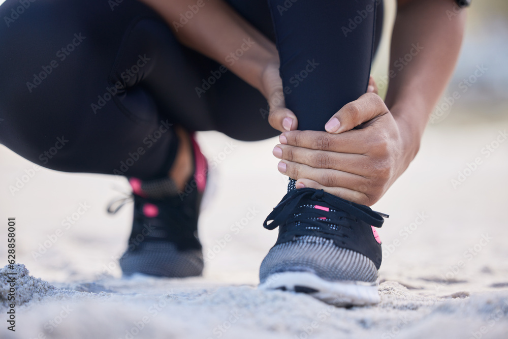 Fitness, ankle pain and running with woman on beach for sports injury, inflammation and accident. Em