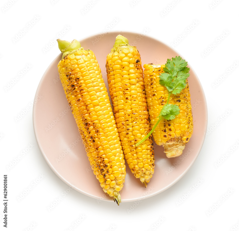 Plate with tasty grilled corn cobs and parsley on white background