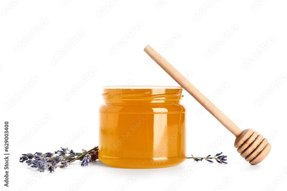 Jar of sweet lavender honey, dipper and flowers on white background