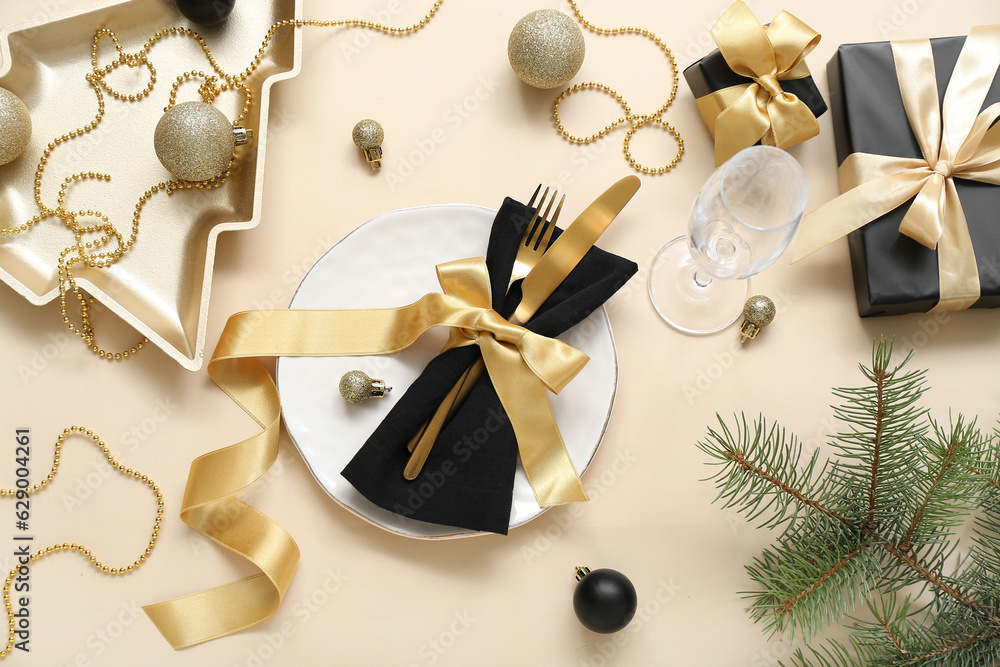 Beautiful table setting for Christmas celebration on beige background