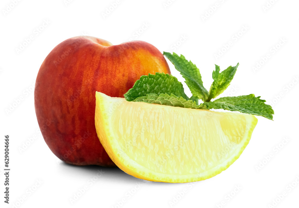 Fresh peaches, lemon and mint on white background