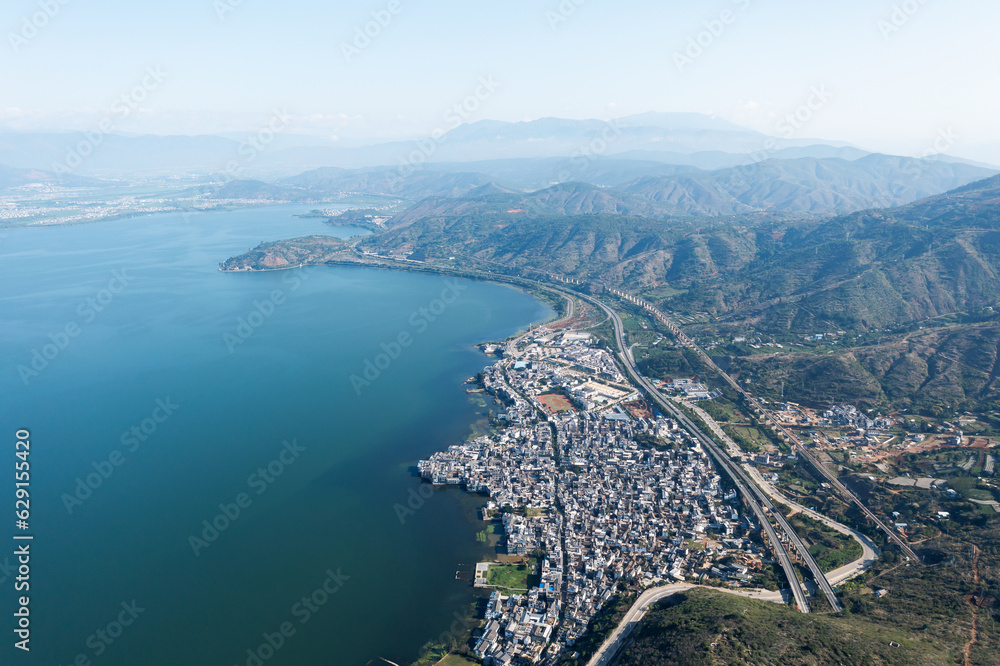 Village and lake in Shuanglang, Yunnan, China.