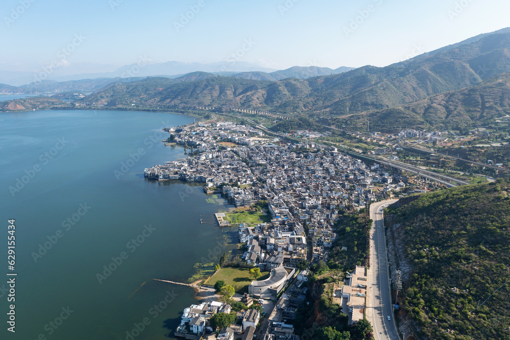 Village and lake in Shuanglang, Yunnan, China.