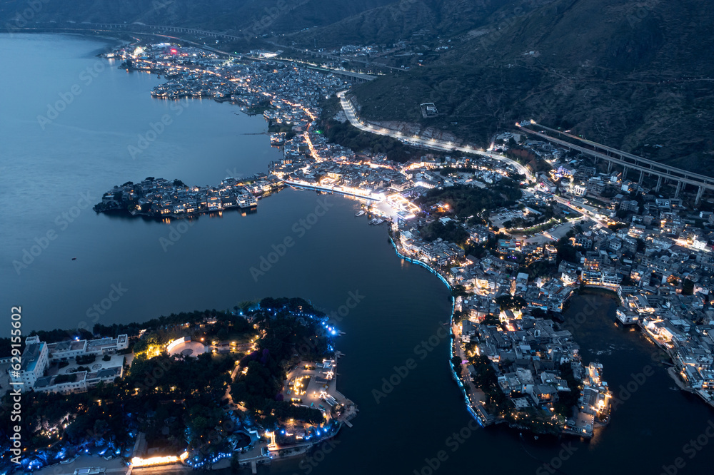 Village and lake in Shuanglang, Yunnan, China.