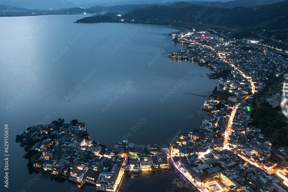 Village and lake in Shuanglang, Yunnan, China.