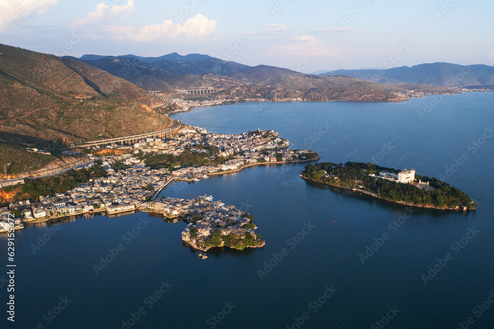 Village and lake in Shuanglang, Yunnan, China.