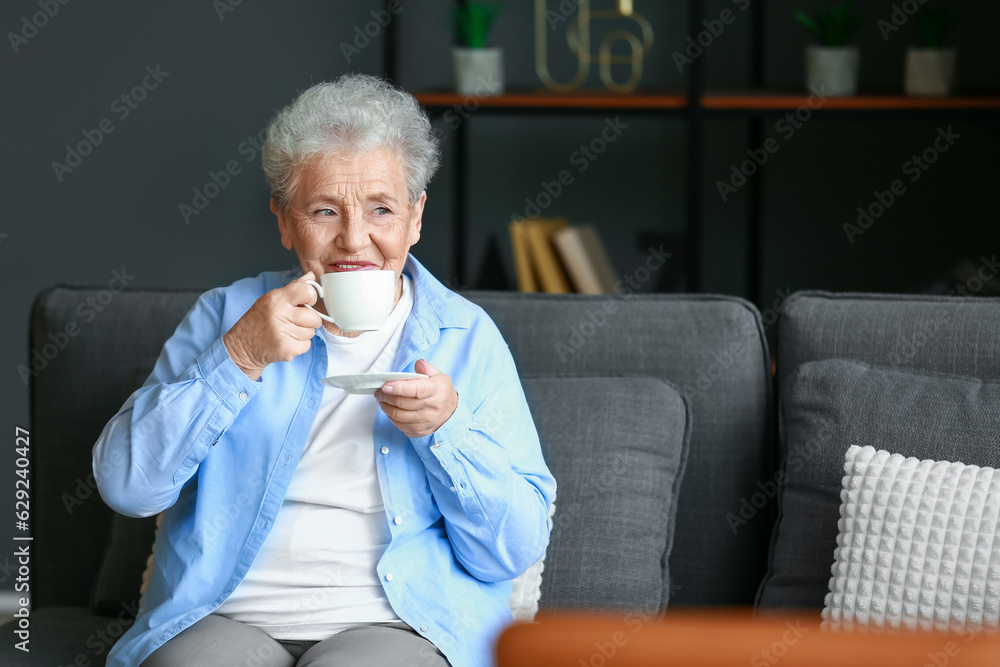 Senior woman drinking coffee at home