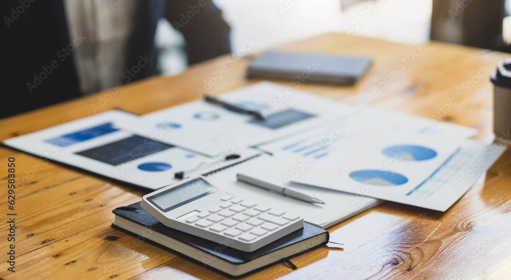 Businessman working on documents on the desk, data analysis of financial figures and business invest