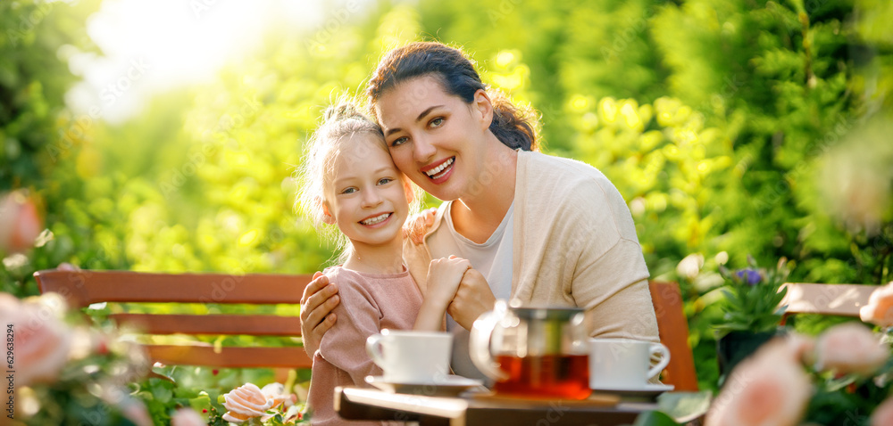 family drinking tea in the garden