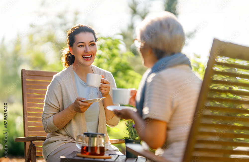 women drinking tea in the garden