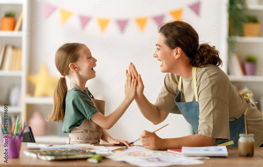 kid and teacher at the art class