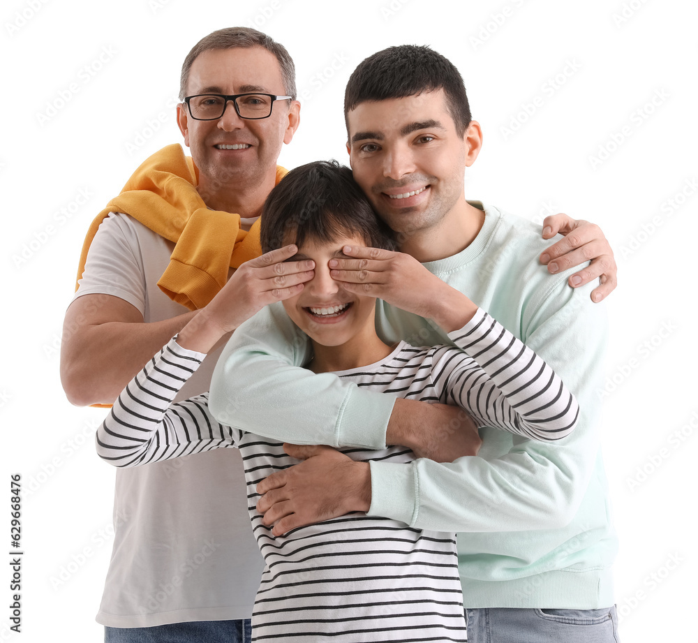 Happy little boy with his dad and grandfather on white background