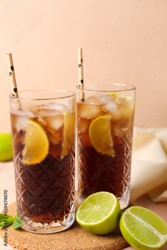 Glasses of cold Cuba Libre cocktail on table