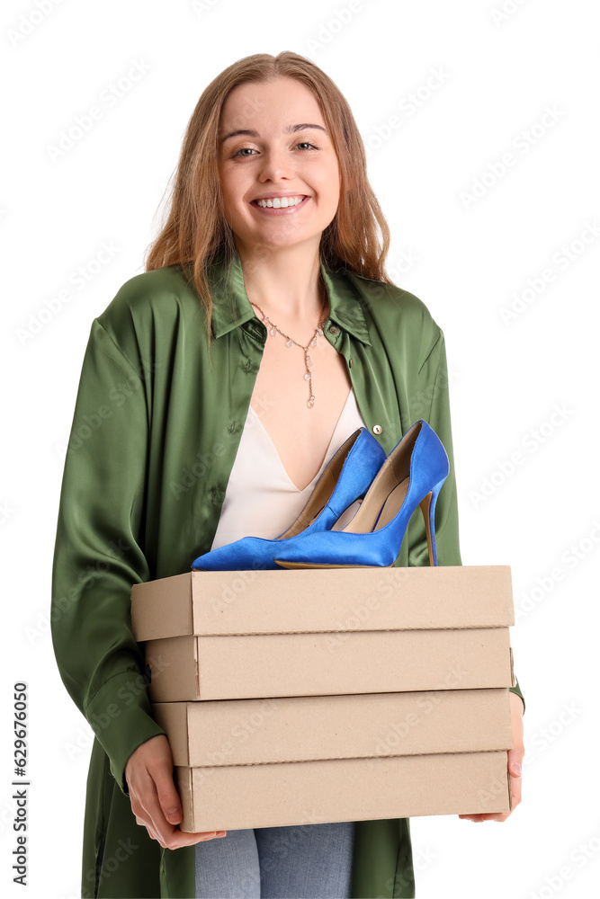 Young woman with shoe boxes on white background