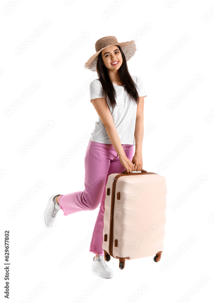 Young woman with beige suitcase on white background