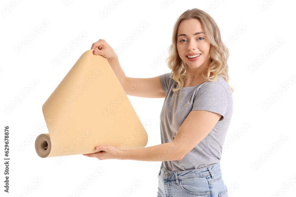 Young woman with wallpaper roll on white background