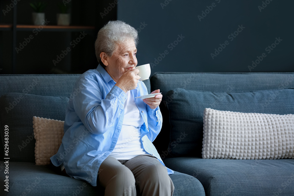 Senior woman drinking coffee at home