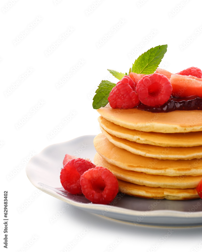 Plate with sweet pancakes and berries on white background, closeup