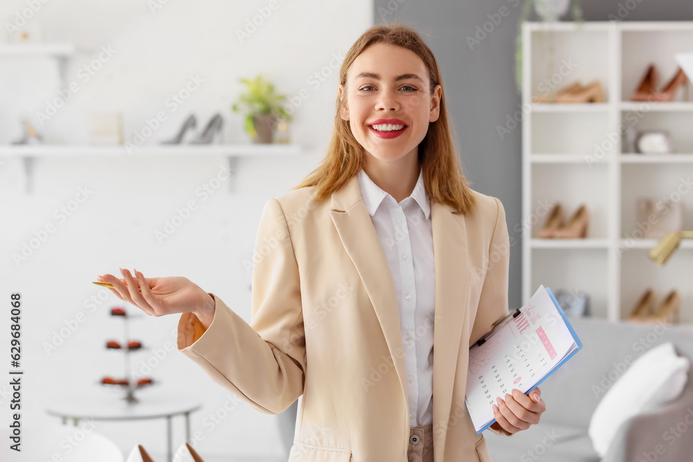 Female wedding planner with Save the Date Announcement in office