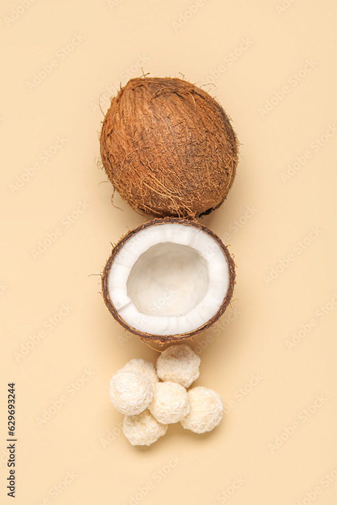 Coconut and white chocolate candies on beige background