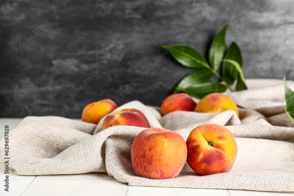 Sweet peaches on white tile table