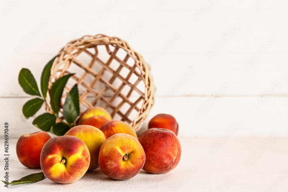 Many sweet peaches on white table