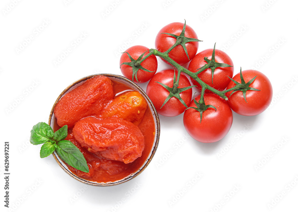 Bowl of canned and fresh tomatoes on white background