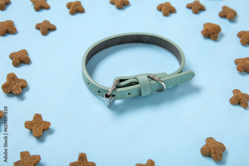 Composition with pet collar and dry food on color background