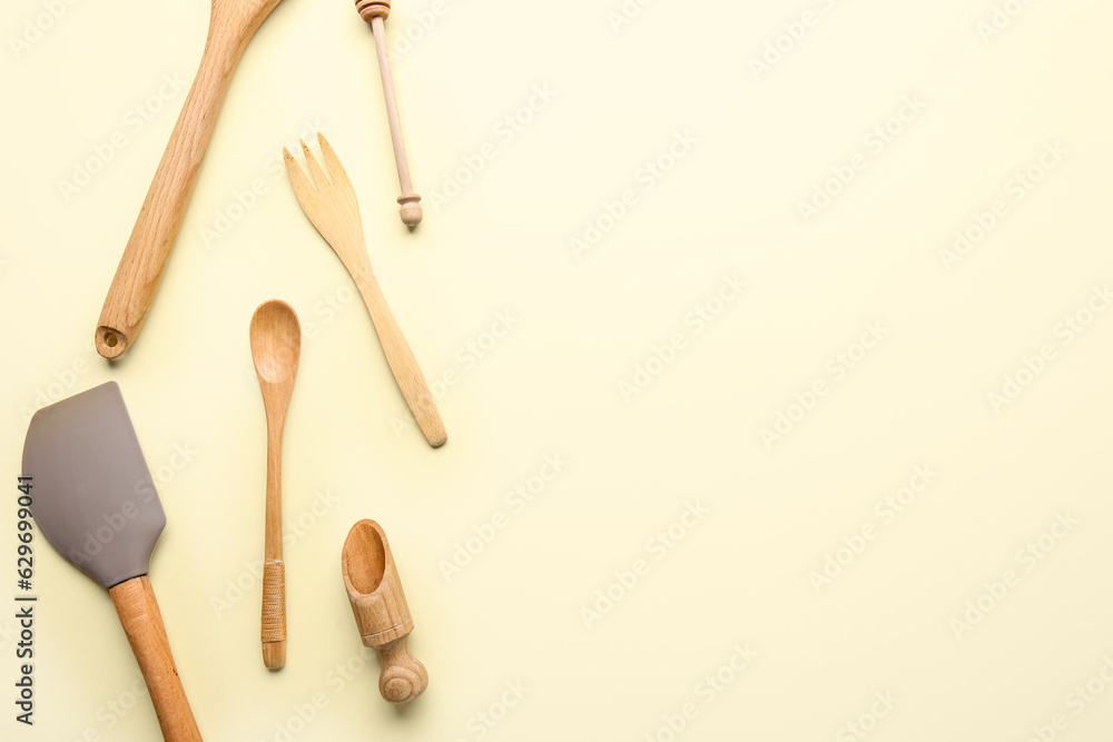 Composition with different kitchen utensils on color background