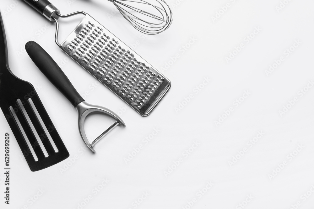 Kitchen utensils on light background