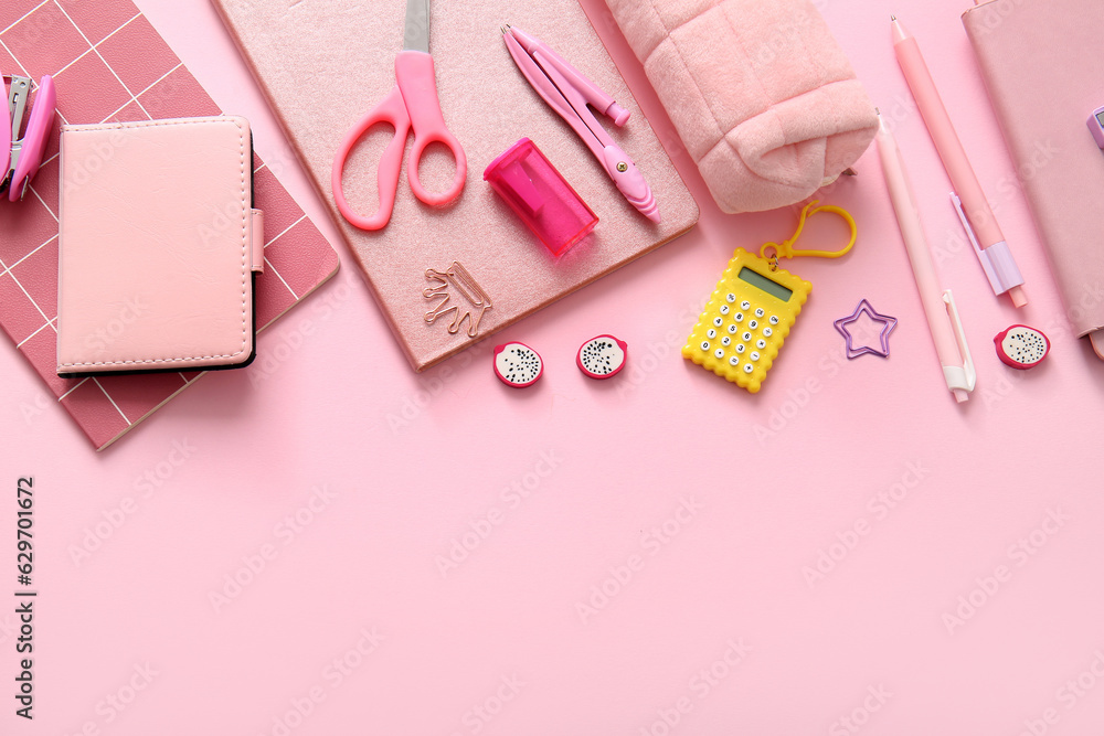 Different school stationery and notebooks on pink background