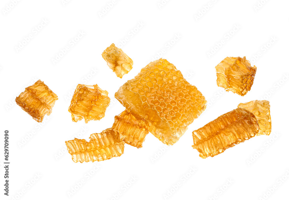 Flying sweet honeycombs on white background