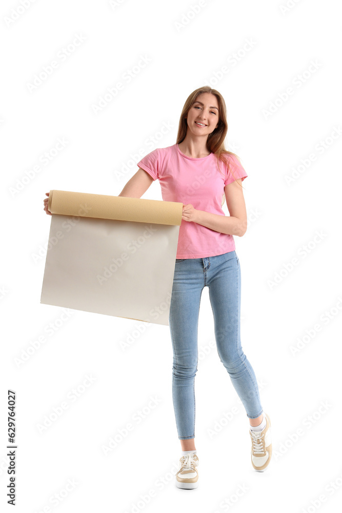 Young woman with wallpaper roll on white background