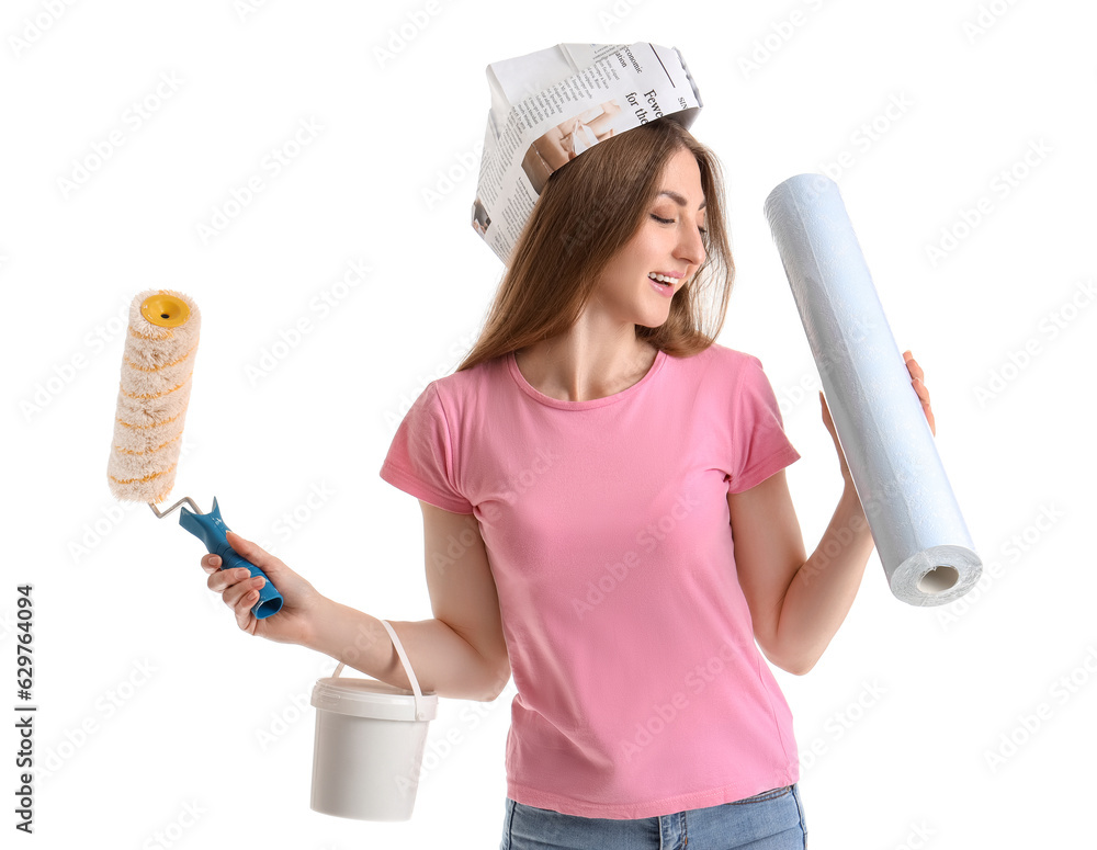 Young woman with wallpaper, roller and glue on white background