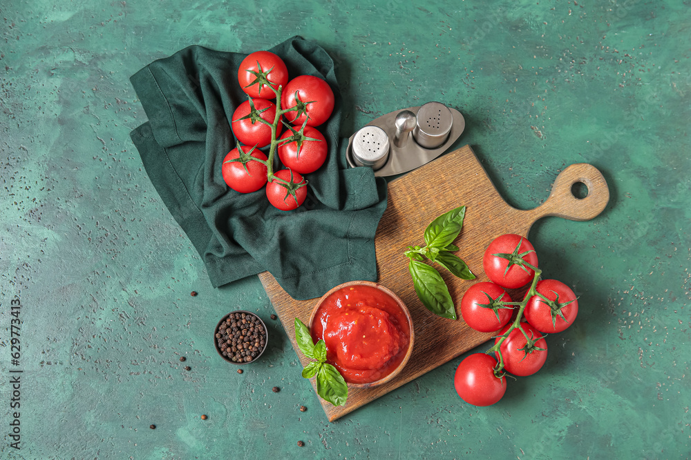 Composition with fresh, canned tomatoes and spices on color background