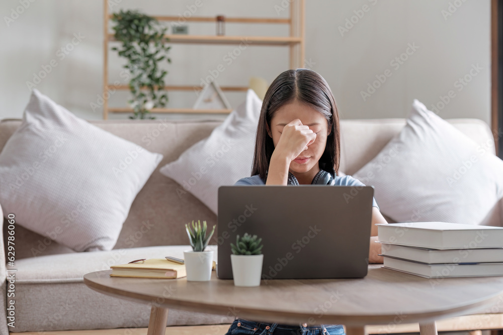 Asian women are bored from their online studies, have a sad face and have been tired from their stud