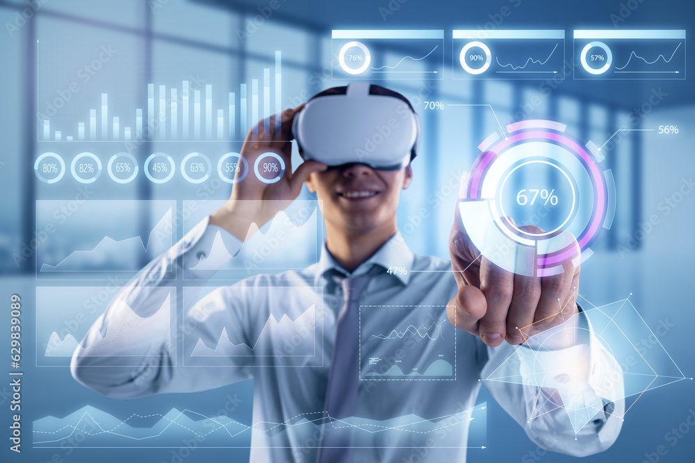 Attractive happy young european businessman with VR glasses and glowing business chart hologram on b