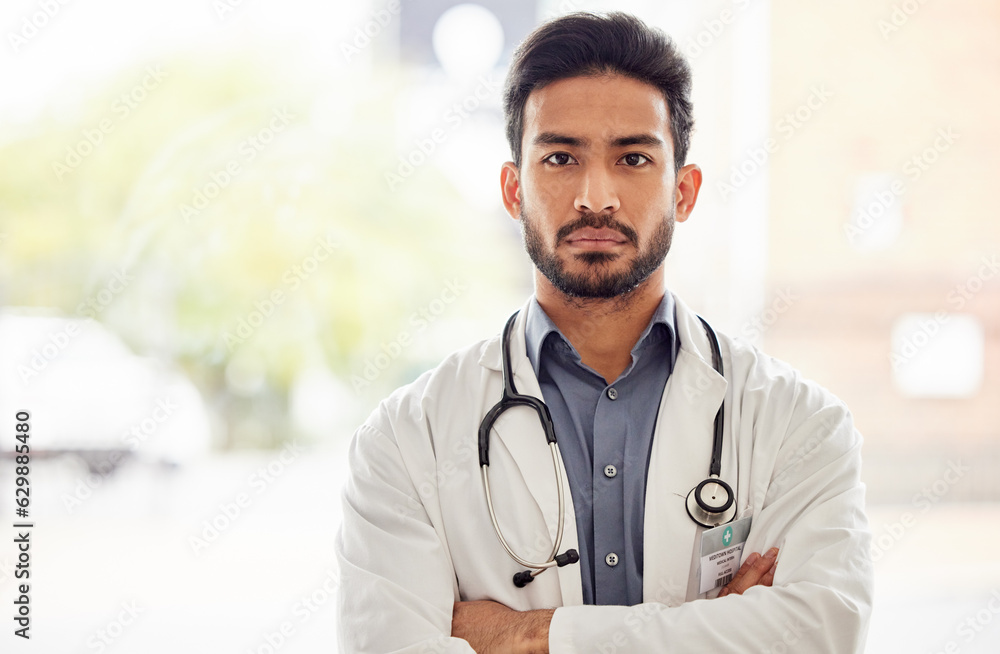 Serious, arms crossed and man doctor portrait in hospital with stethoscope, attitude and determined 