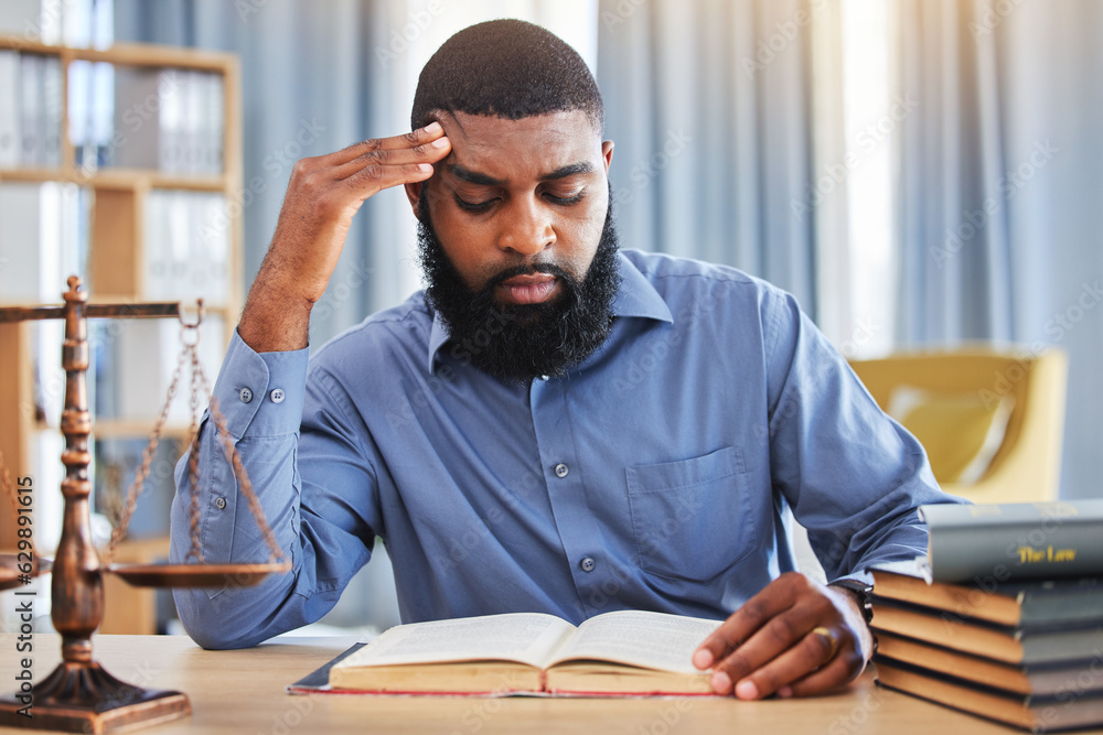 Black man, lawyer and reading book with stress in office from worry, pain or frustrated with challen